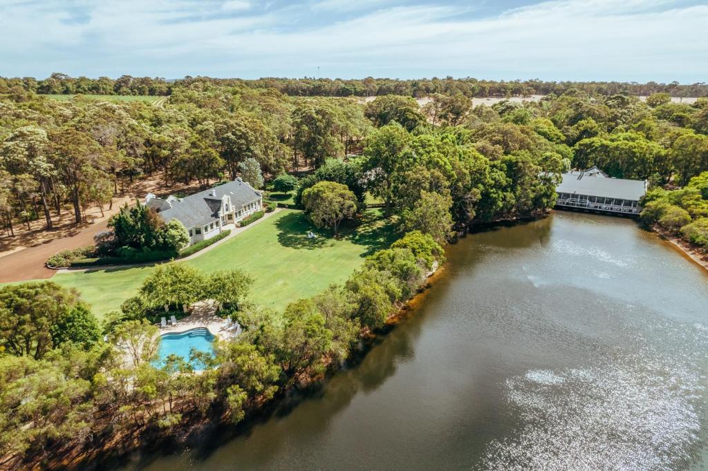 an aerial view of a house and a river at Cape Lodge in Yallingup