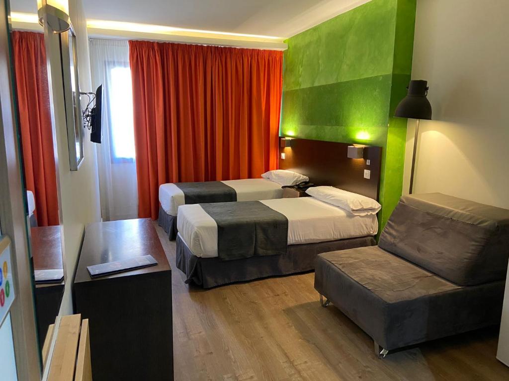 Postel nebo postele na pokoji v ubytování Apartamentos Recoletos