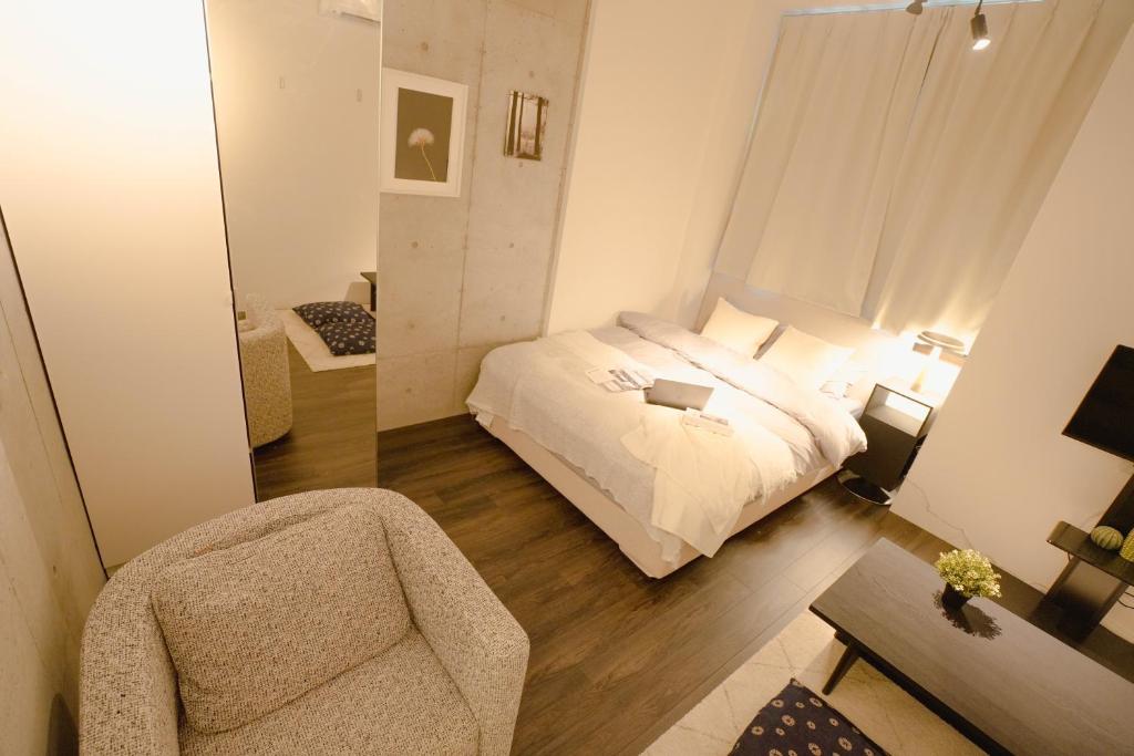 Postel nebo postele na pokoji v ubytování FL Residence Seeikokan III
