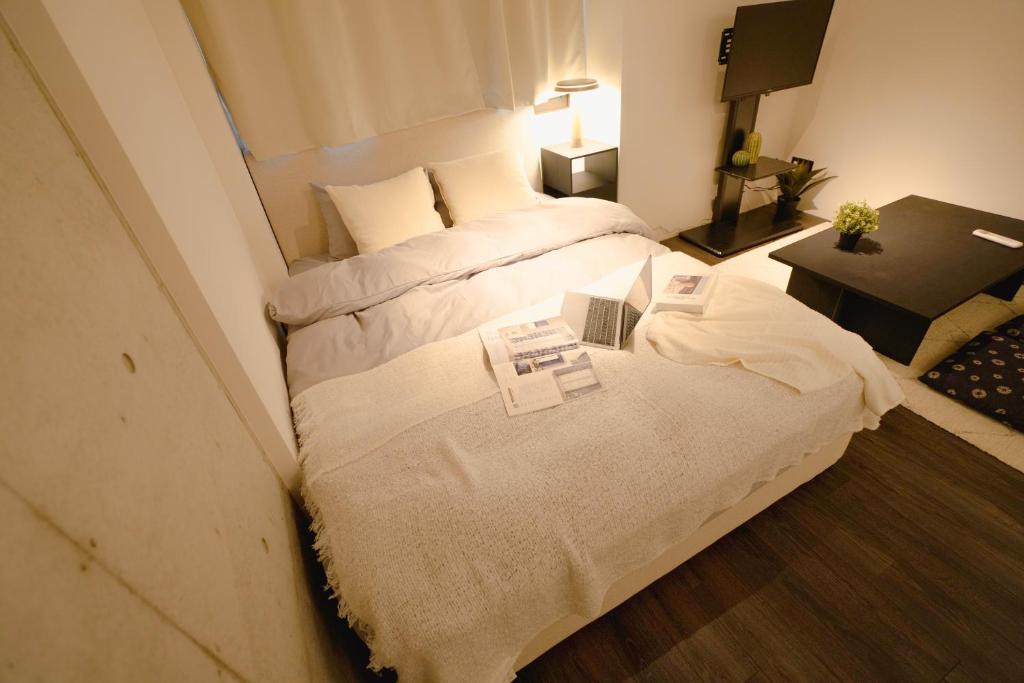 Postel nebo postele na pokoji v ubytování FL Residence Seeikokan III