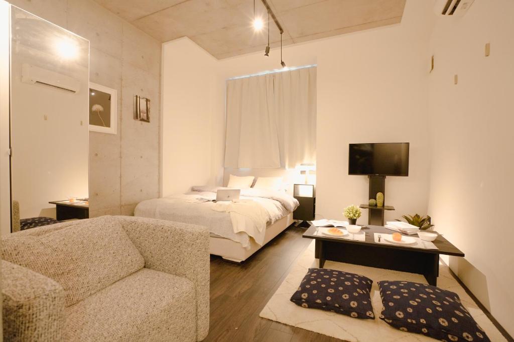 Postel nebo postele na pokoji v ubytování FL Residence Seeikokan III