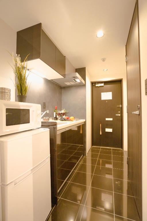 Kuchyň nebo kuchyňský kout v ubytování FL Residence Seeikokan III