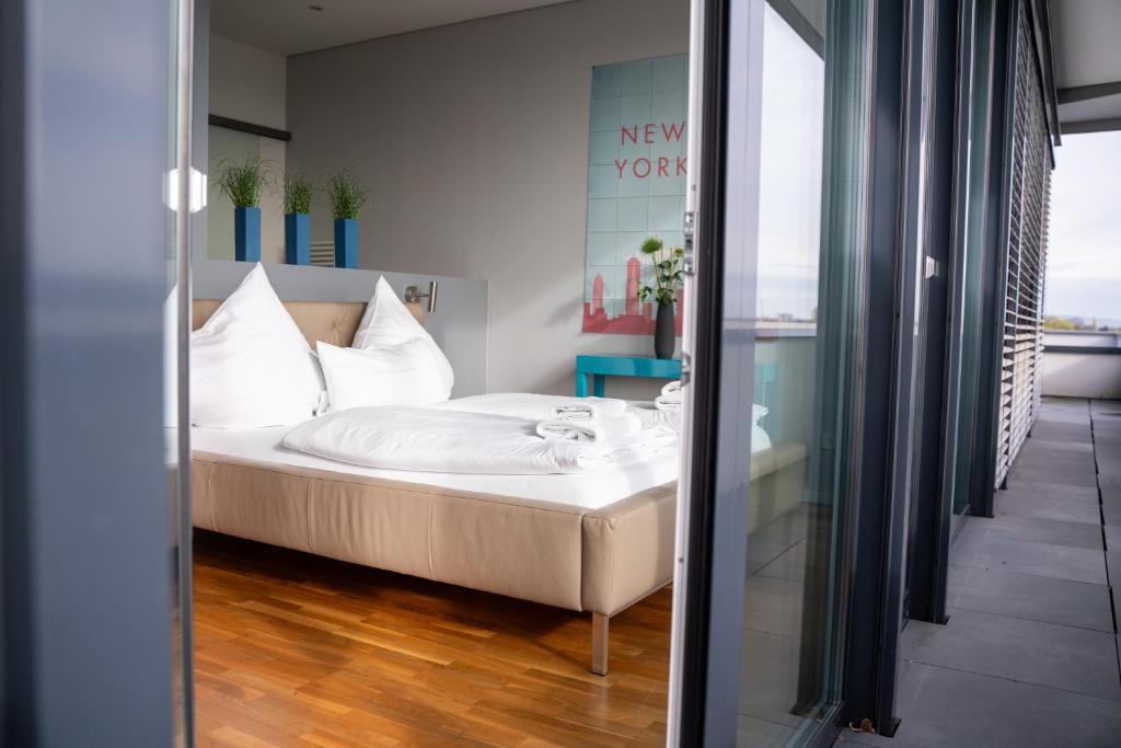 Postel nebo postele na pokoji v ubytování Hotel Soho