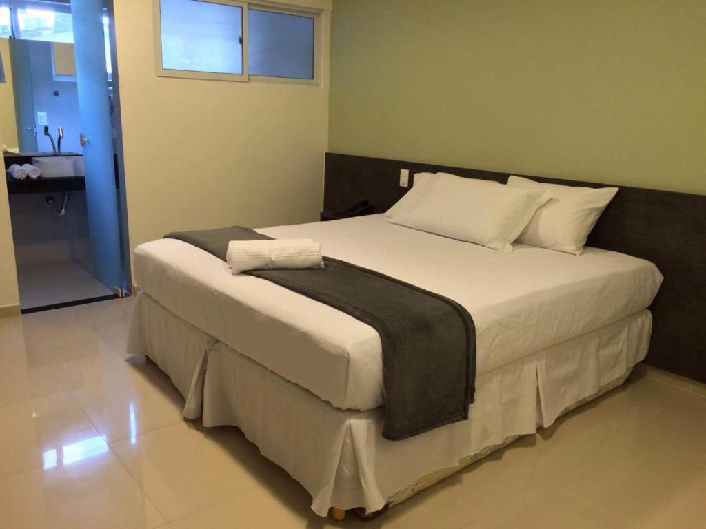 Cama ou camas em um quarto em Scenarium Hotel