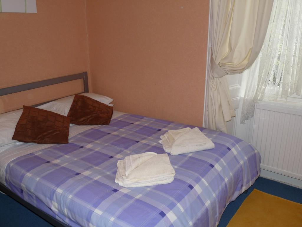 Postel nebo postele na pokoji v ubytování Arbour Guest House