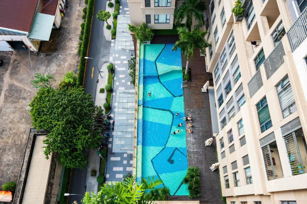 an overhead view of a swimming pool in the middle of a building at January Apartment in Ho Chi Minh City