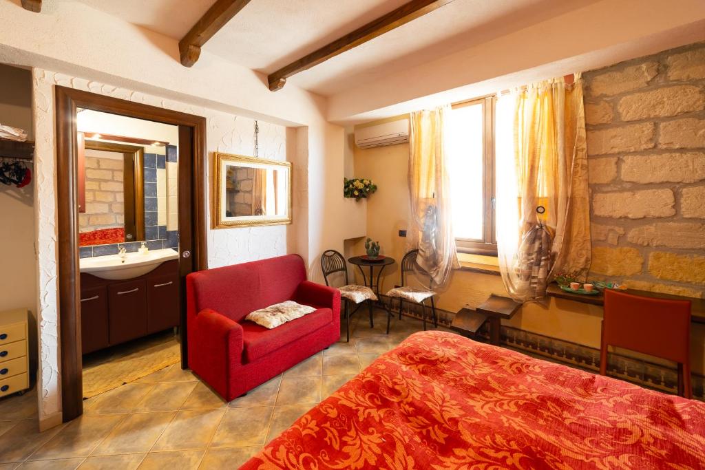 Postel nebo postele na pokoji v ubytování B&B Alfrantoio Valderice