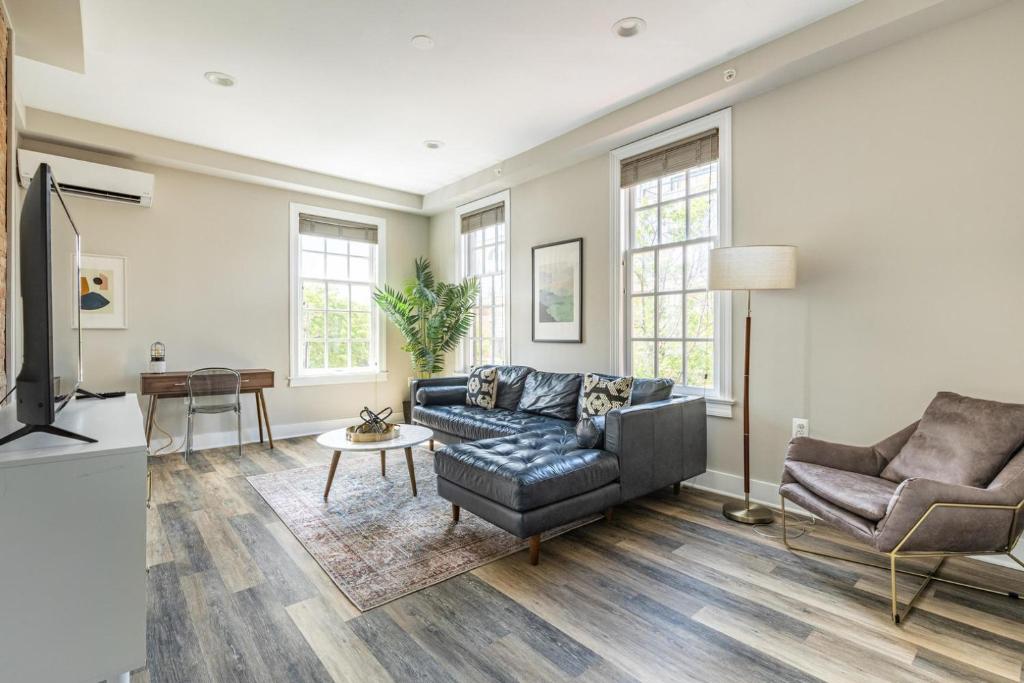 a living room with a couch and a tv at Alexandria West 2br w wd nr dining WDC-769 in Alexandria