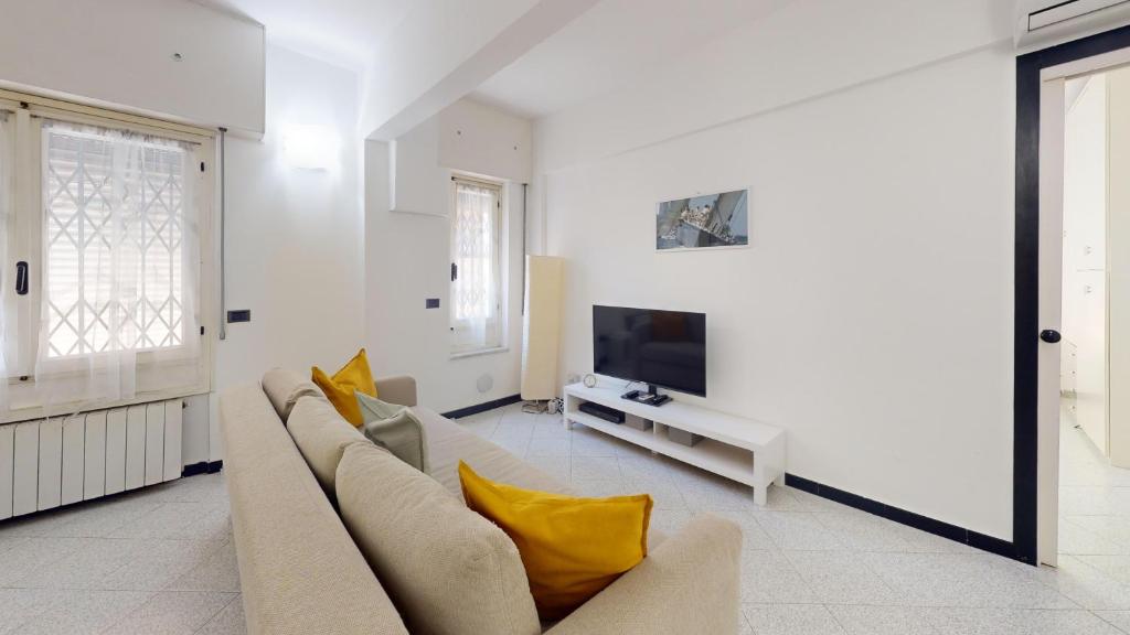Televízia a/alebo spoločenská miestnosť v ubytovaní Casa Anna - By Ligooria