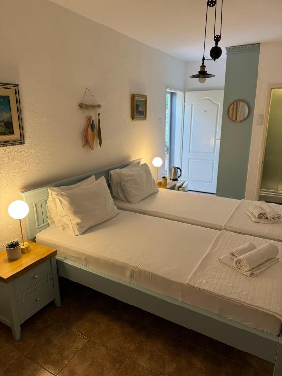 Postel nebo postele na pokoji v ubytování Guest House Amfora