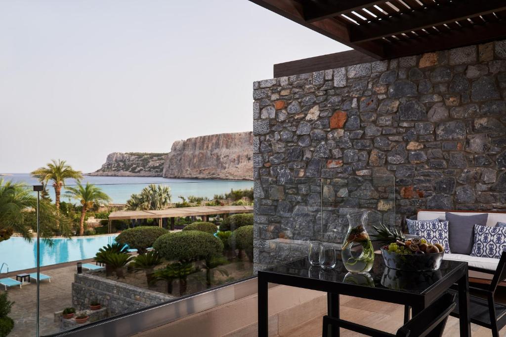 a room with a view of the ocean at Aquagrand Exclusive Deluxe Resort Lindos - Adults only in Lindos
