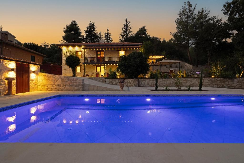 een groot blauw zwembad voor een huis bij No 1 Mandria in Limassol