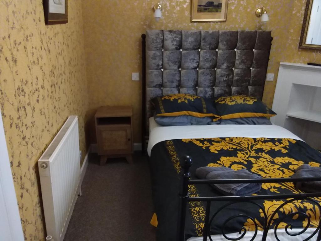 Postel nebo postele na pokoji v ubytování IVY- Braveheart Guest House
