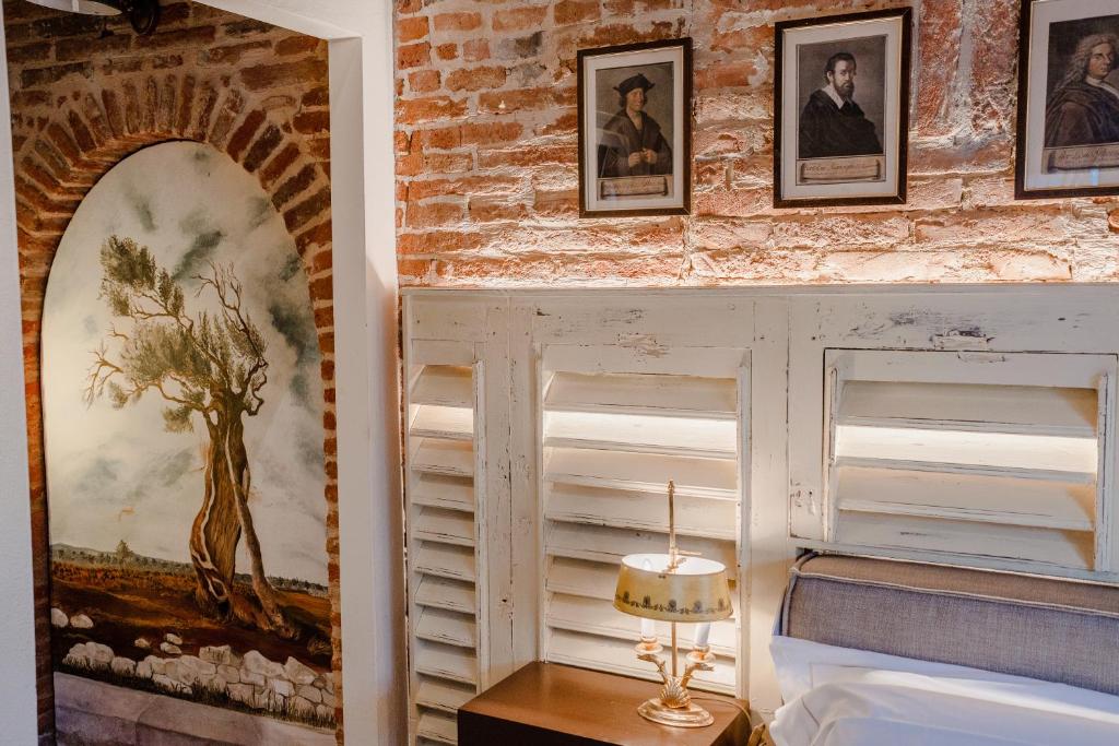 Postel nebo postele na pokoji v ubytování Equo Suites