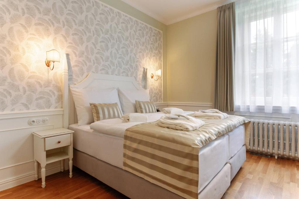 Postel nebo postele na pokoji v ubytování GOYA Vitality Hotel