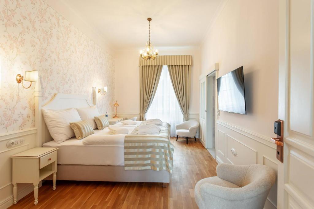 Postel nebo postele na pokoji v ubytování GOYA Vitality Hotel