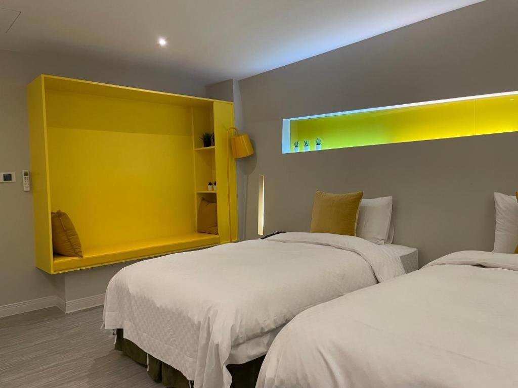 Postel nebo postele na pokoji v ubytování Ya Nold Hot Spring Hotel