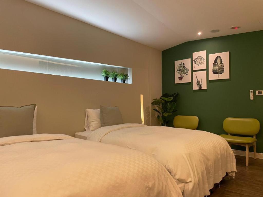 Postel nebo postele na pokoji v ubytování Ya Nold Hot Spring Hotel