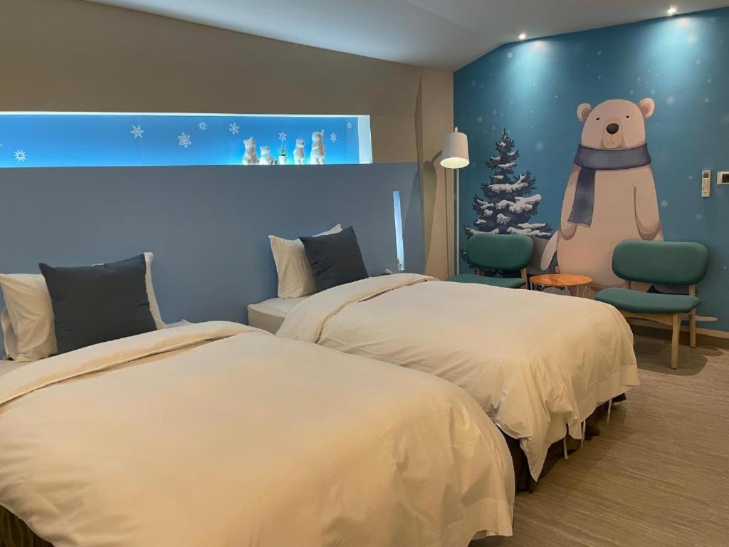Postel nebo postele na pokoji v ubytování Ya Nold Hot Spring Hotel