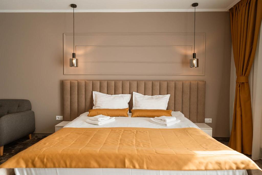 Postel nebo postele na pokoji v ubytování ALLEGRIA HOTEL Spa
