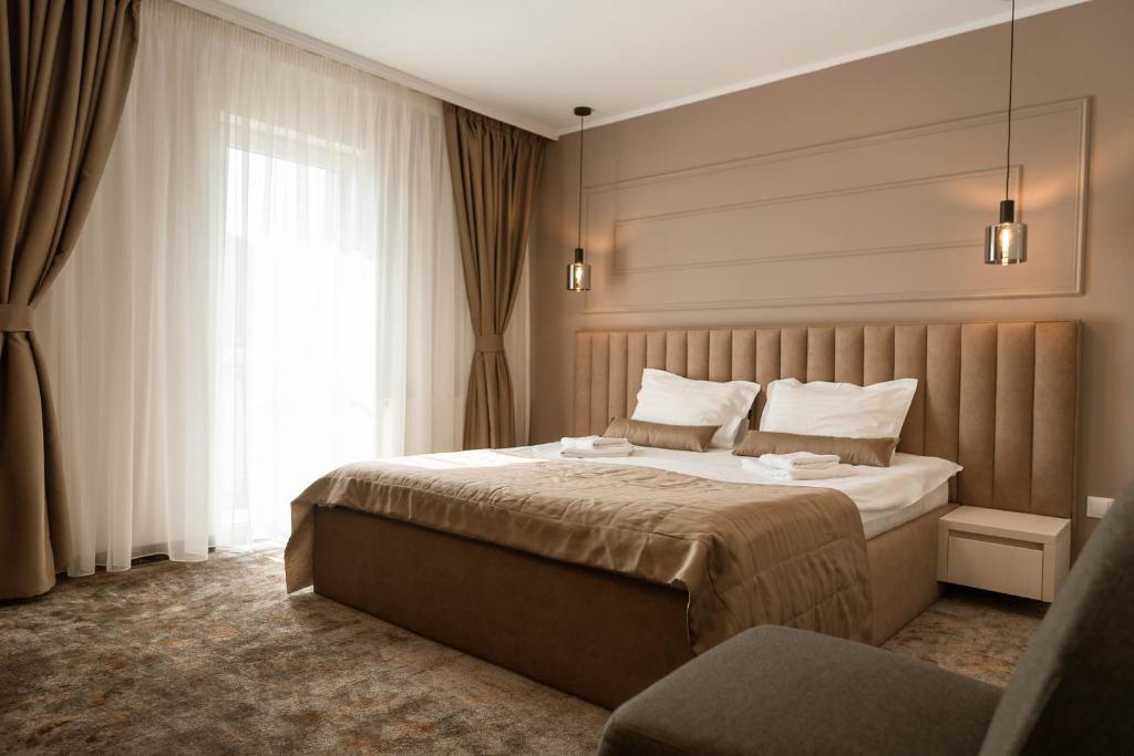 Postel nebo postele na pokoji v ubytování ALLEGRIA HOTEL Spa