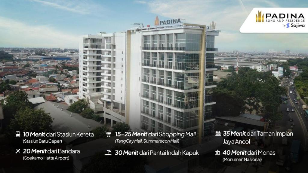 a tall white building with the words panama at PADINA SUITES in Poris
