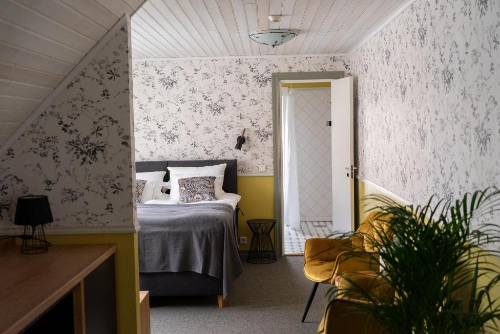 Postel nebo postele na pokoji v ubytování Vanalinna Boutique Hotel