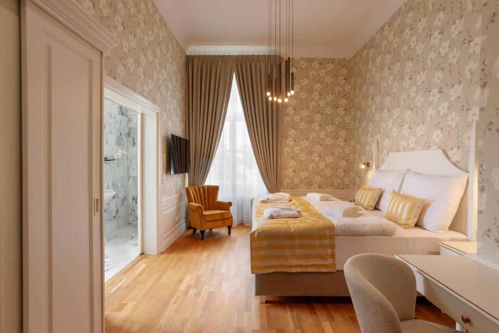 Postel nebo postele na pokoji v ubytování GOYA Vitality Hotel