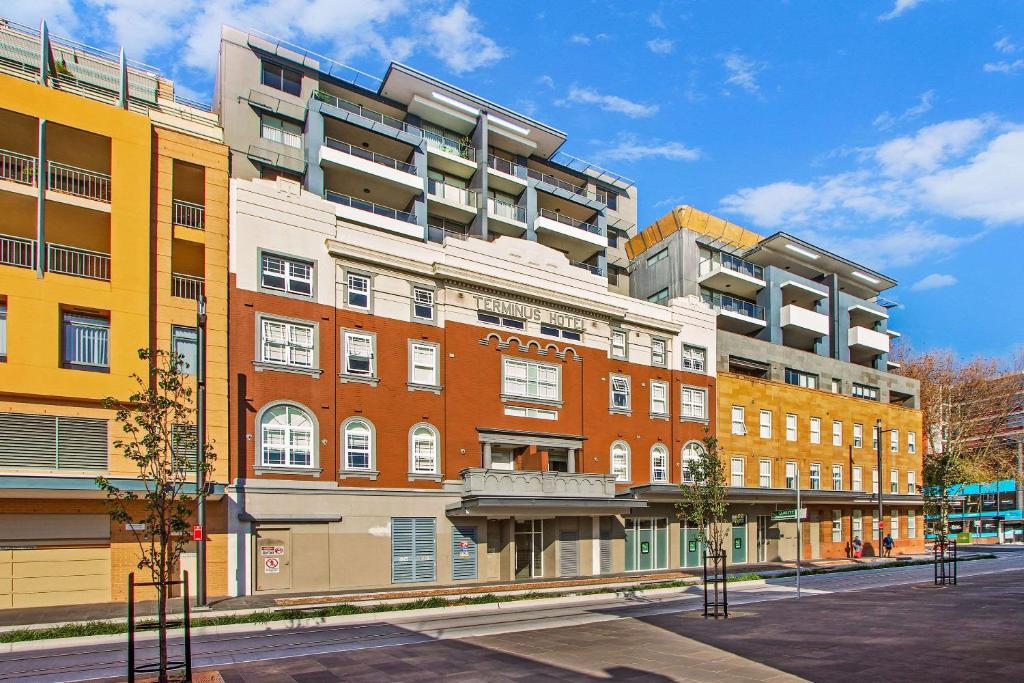 a building on a street in a city at Terminus Apartment Hotel, Ascend Hotel Collection in Newcastle