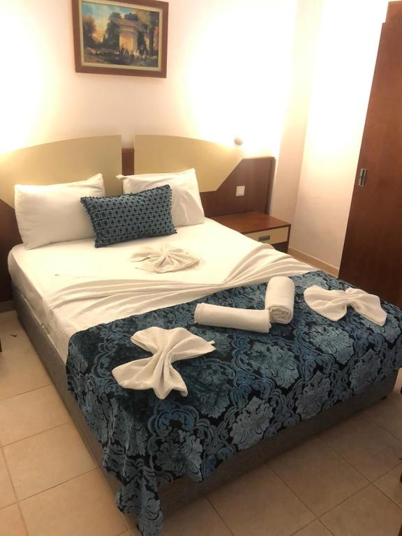 Postel nebo postele na pokoji v ubytování Best Hotel