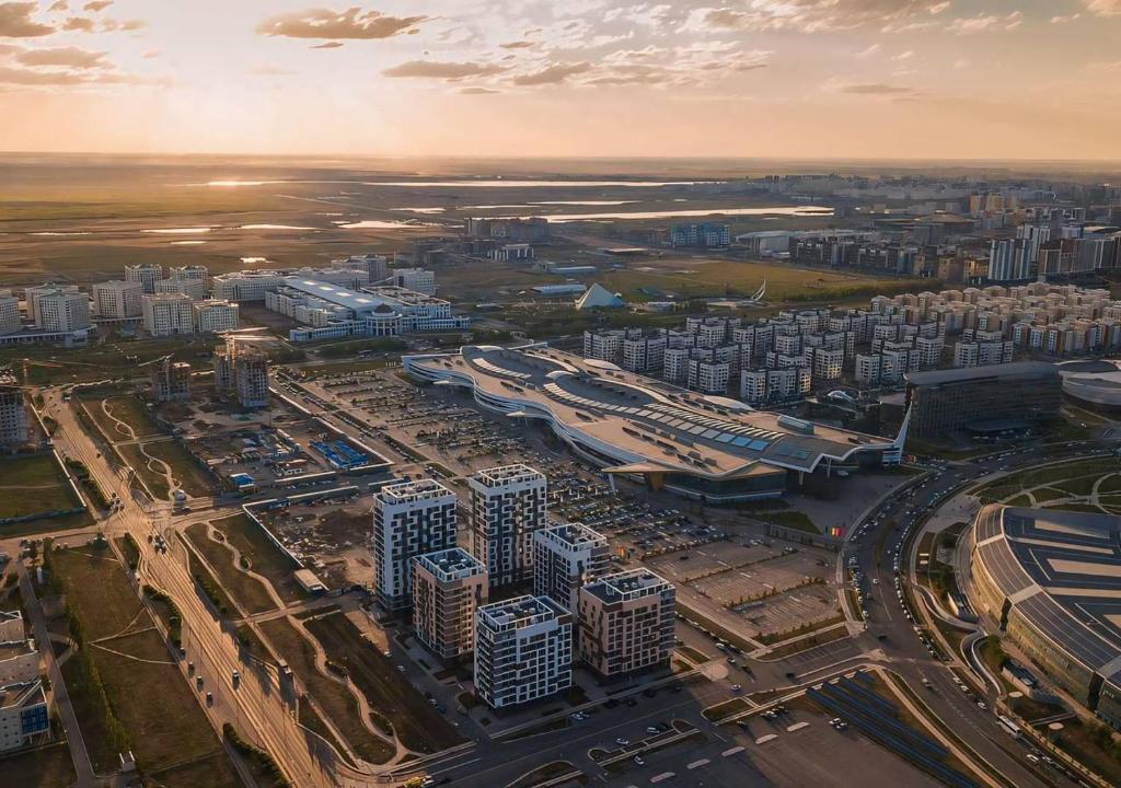 an aerial view of a city with tall buildings at Красивая квартира возле EXPO, Nexpo City in Astana