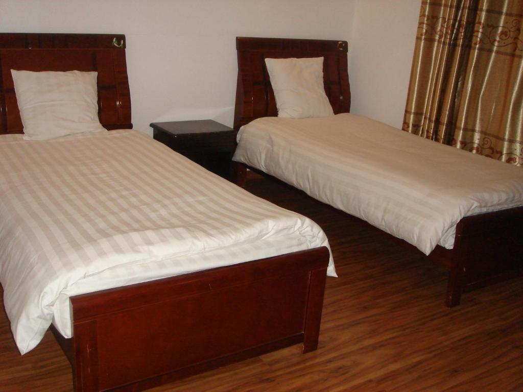 Postel nebo postele na pokoji v ubytování Hotel Restaurant Dao