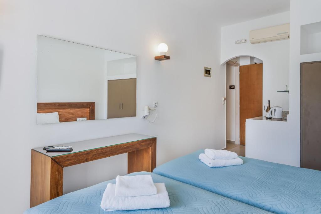 Postel nebo postele na pokoji v ubytování Creta Verano Hotel