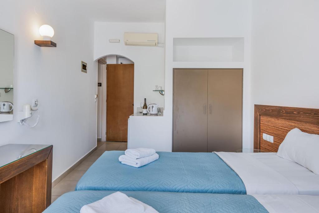 Postel nebo postele na pokoji v ubytování Creta Verano Hotel