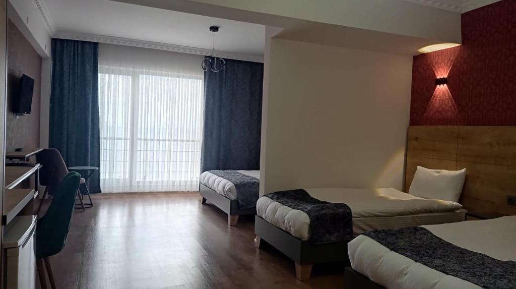 Ein Bett oder Betten in einem Zimmer der Unterkunft Orient Hotel