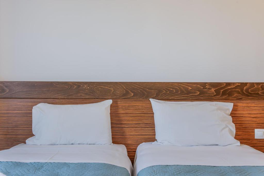 Postel nebo postele na pokoji v ubytování Creta Verano Hotel
