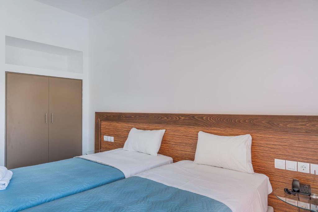 Postel nebo postele na pokoji v ubytování Creta Verano Hotel