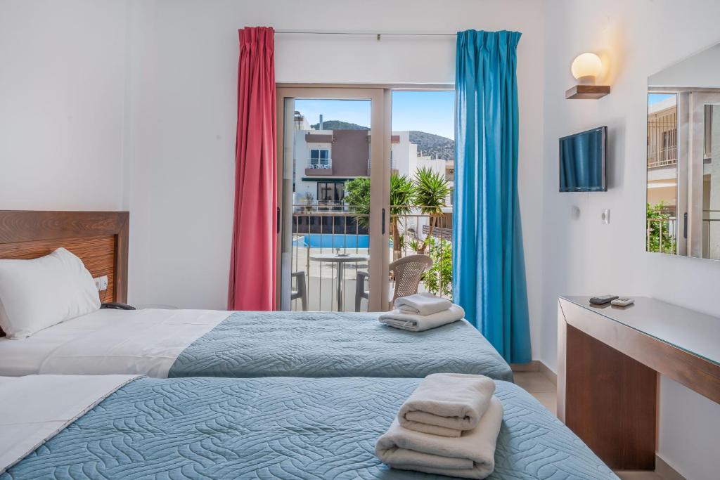 Postel nebo postele na pokoji v ubytování Creta Verano Hotel