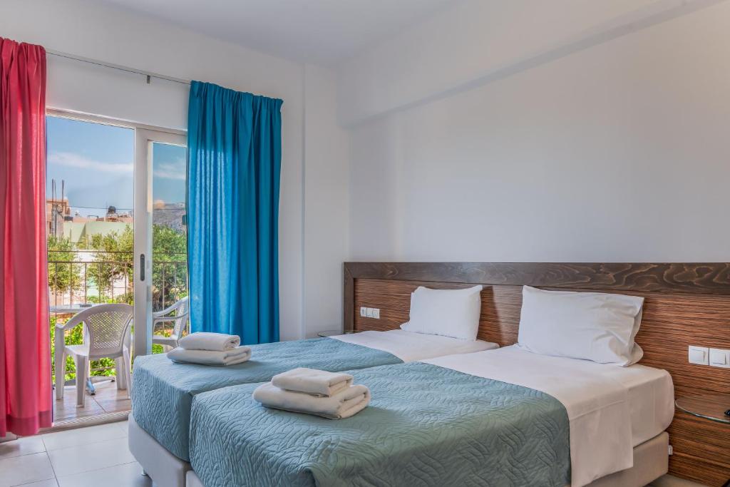 Postel nebo postele na pokoji v ubytování Creta Verano Hotel