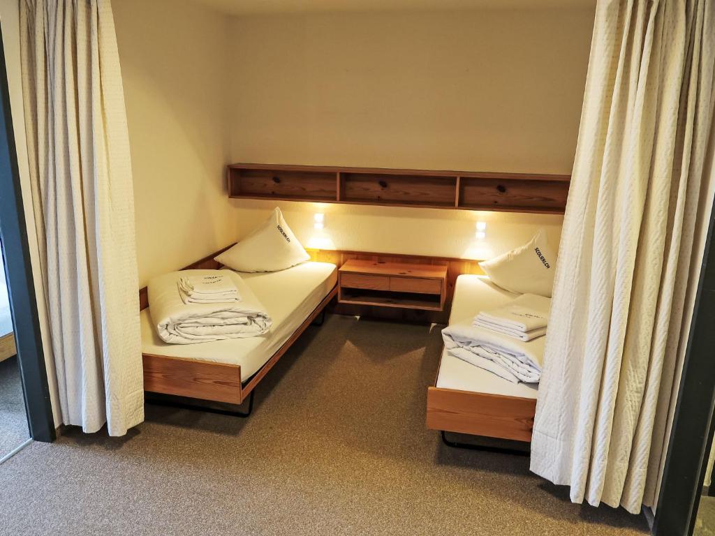 Postel nebo postele na pokoji v ubytování Apartment Apt B 022 by Interhome