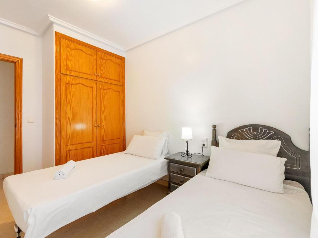 A bed or beds in a room at Apartment Edificio Las Americas by Interhome