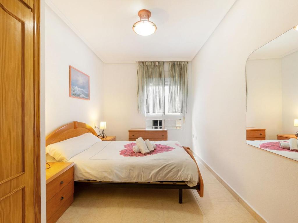 A bed or beds in a room at Apartment Edificio Las Americas by Interhome