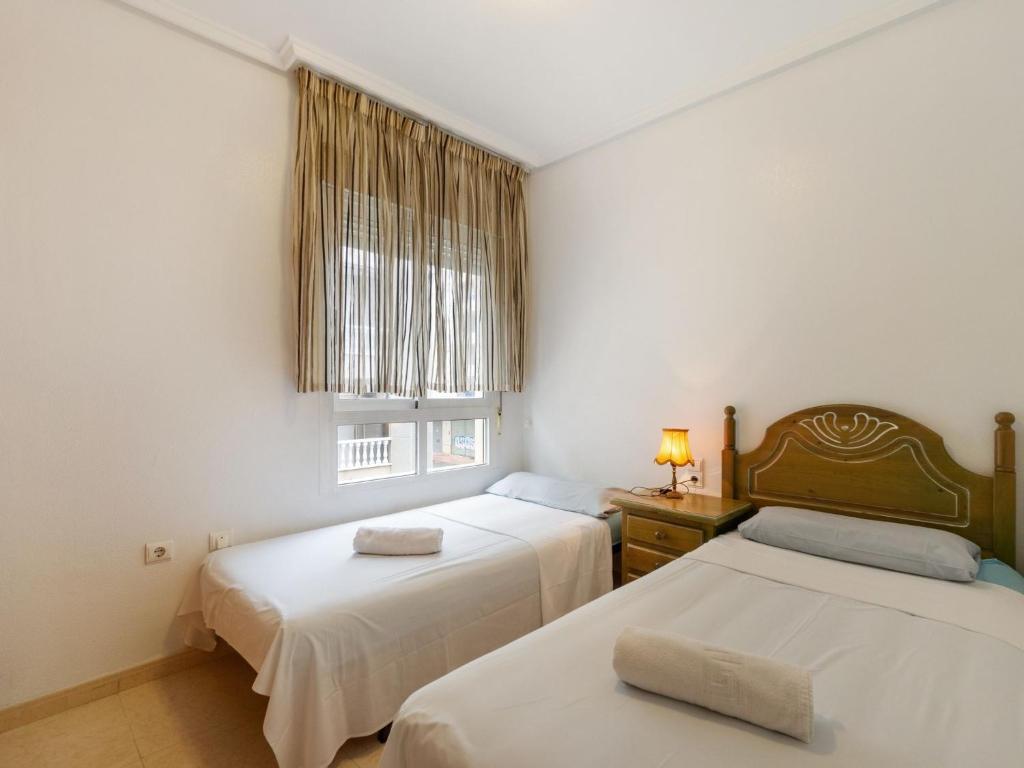 A bed or beds in a room at Apartment Edificio Las Americas by Interhome