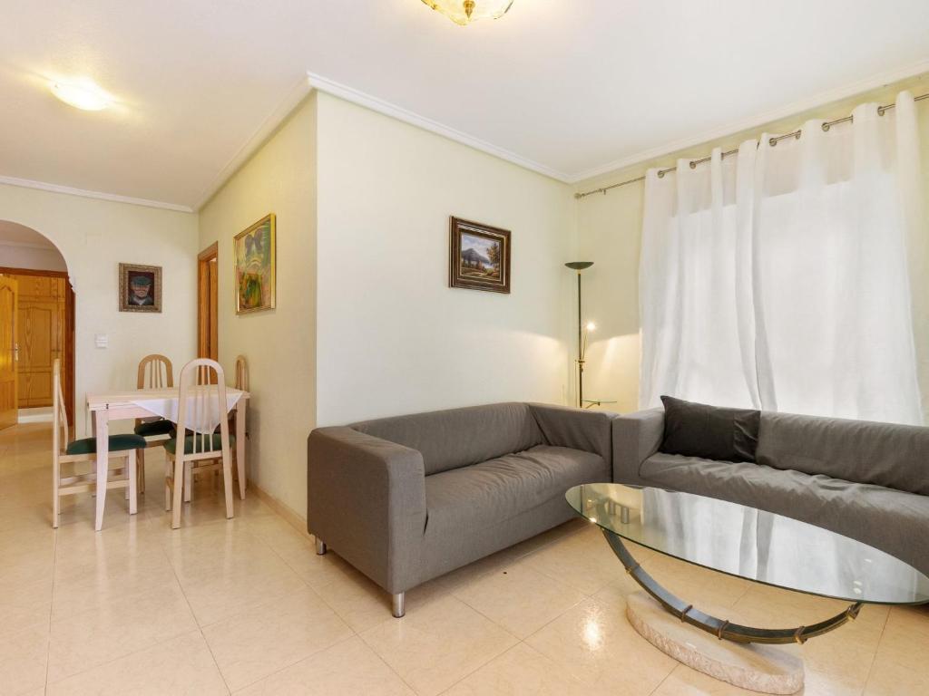 A seating area at Apartment Edificio Las Americas by Interhome
