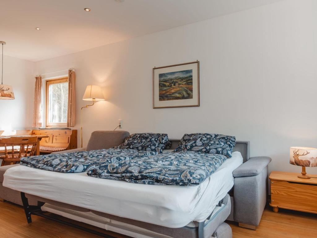 A bed or beds in a room at Apartment Holger by Interhome