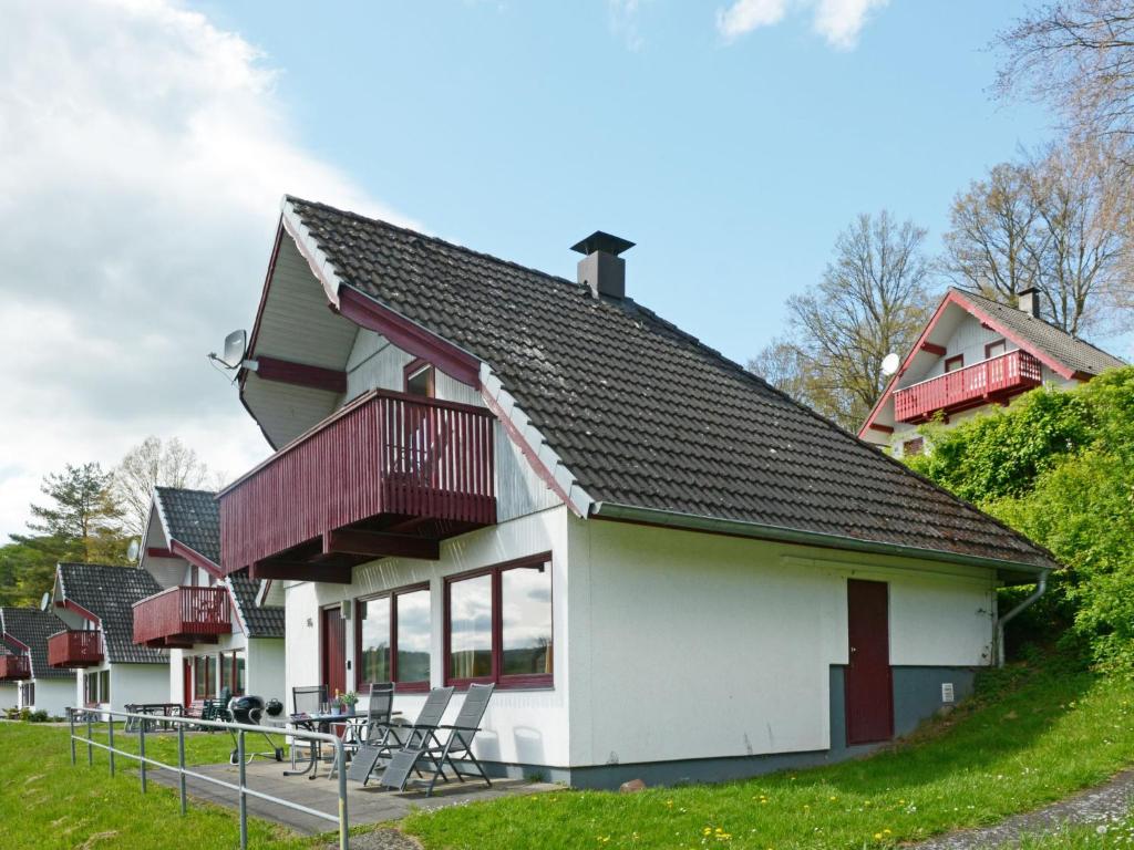 a house with red and white at Holiday Home Dorf 1-Haus 14 by Interhome in Kirchheim