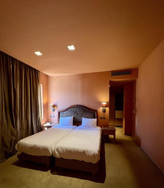 Posteľ alebo postele v izbe v ubytovaní Mainalon Resort