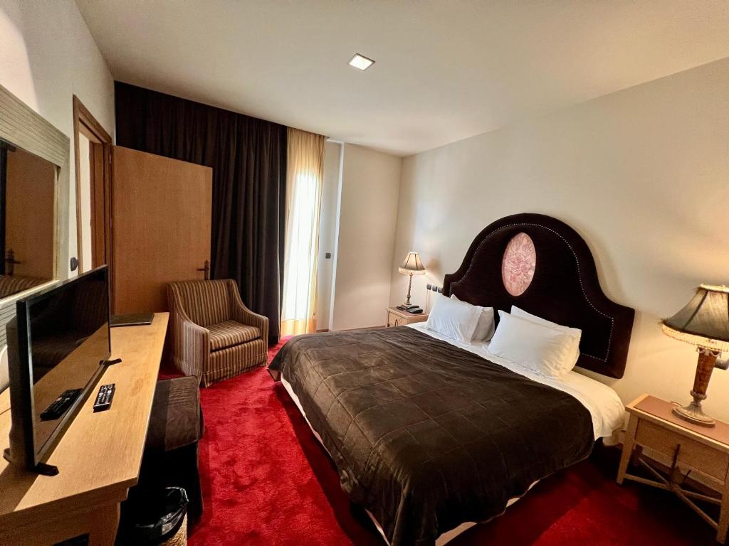 Posteľ alebo postele v izbe v ubytovaní Mainalon Resort