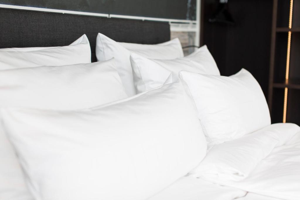 Postel nebo postele na pokoji v ubytování Toploft The Aparthotel