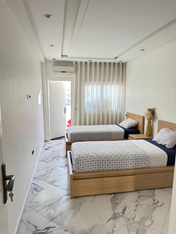 Postel nebo postele na pokoji v ubytování Rabat Agdal Room in shared apartment